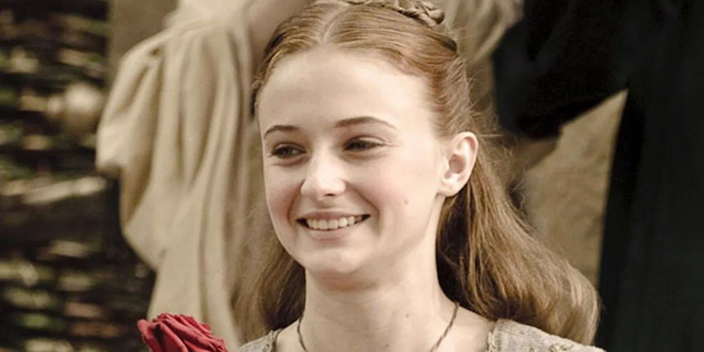 Sansa Stark smiles at a rose given by Loras Tyrell in Game of Thrones.