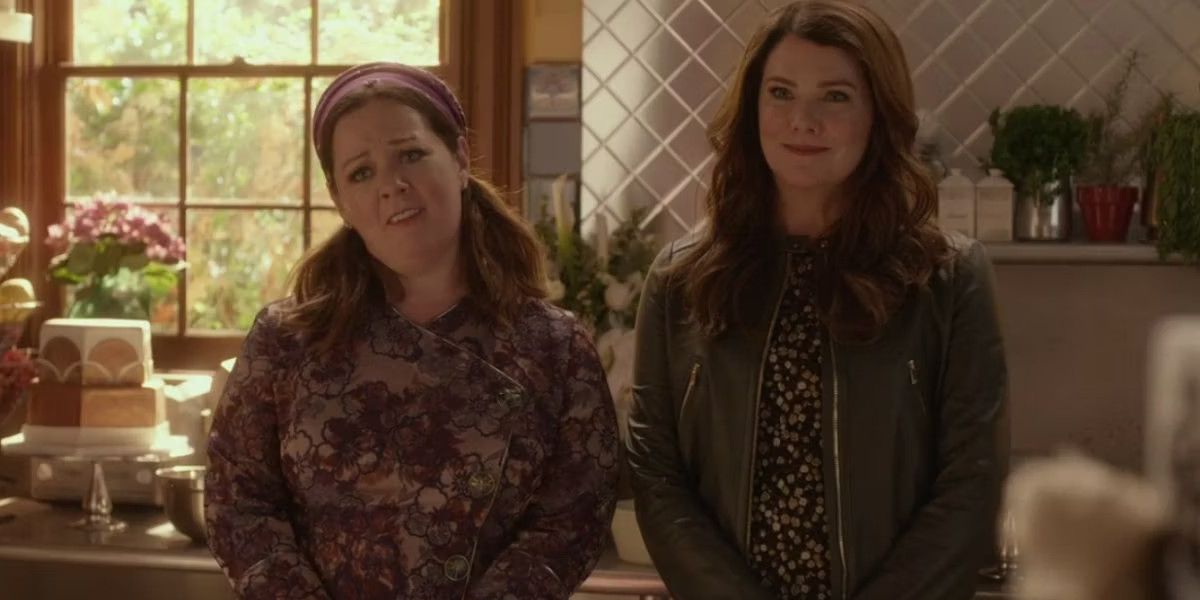 Sookie and Lorelai standing in their kitchen.