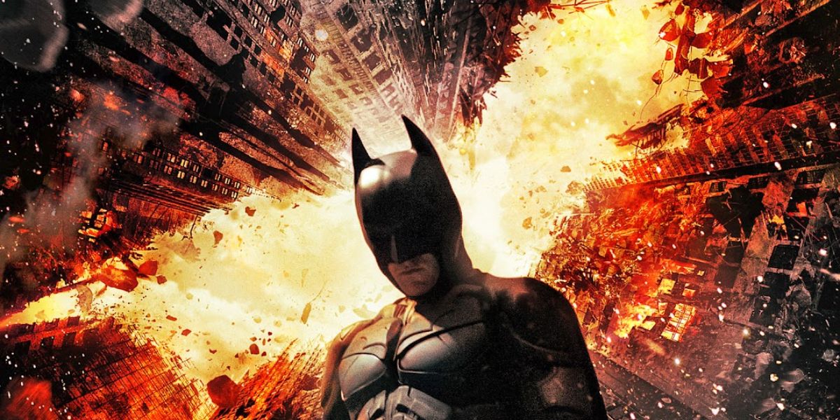 Batman surrounded by burning buildings from The Dark Knight Rises film poster.