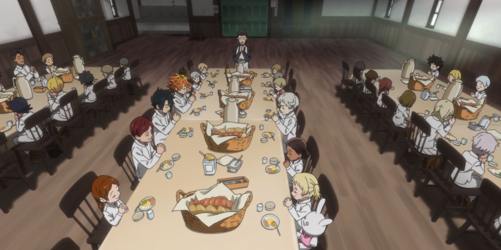 Orphans eat at Grace Field House in The Promised Neverland