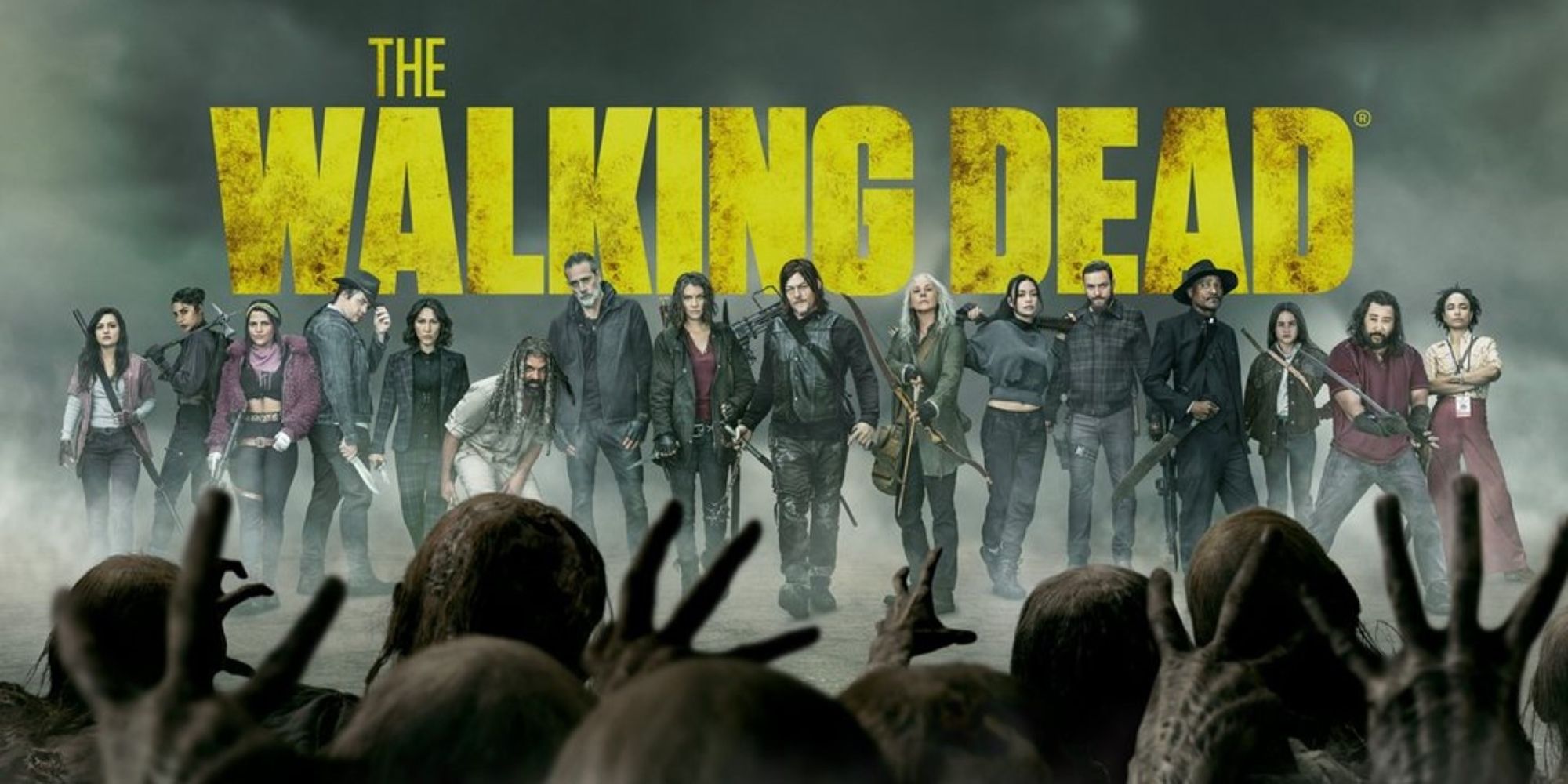 Promotional art for The Walking Dead with walkers in the foreground and the main cast facing them