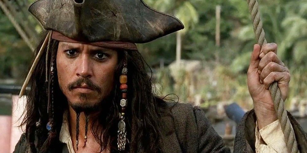 Captain Jack Sparrow with a quizzical look in Pirates of the Caribbean: The Curse of the Black Pearl.