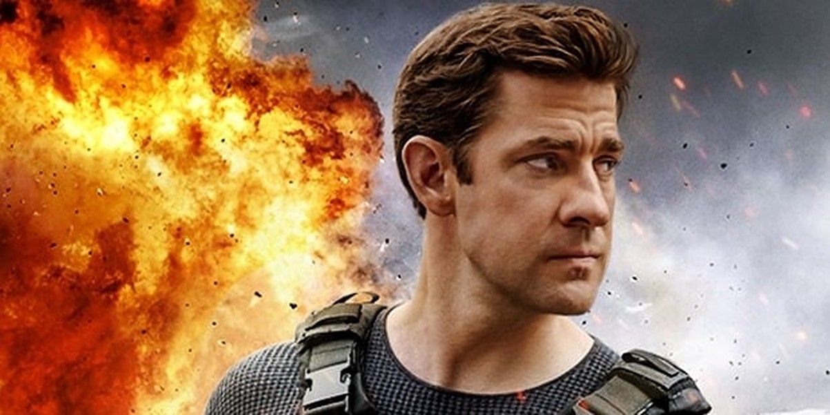 Jack Ryan in tactical gear with an explosion behind him