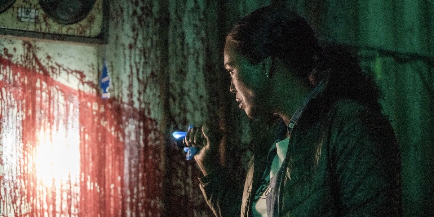 Tara investigates a blood splatter in Criminal Minds: Evolution
