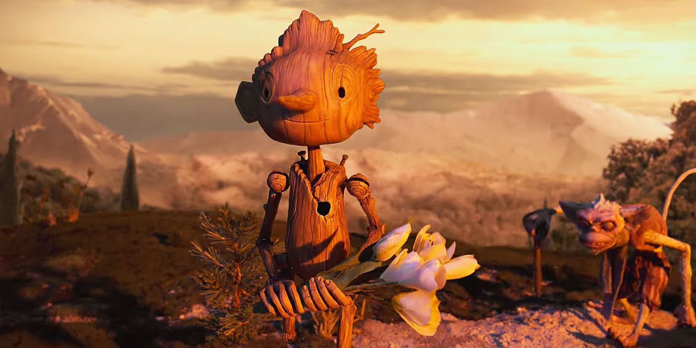 Gregory Mann's Pinocchio holds a bouquet of white flowers in the trailer for Guillermo del Toro's Pinocchio.