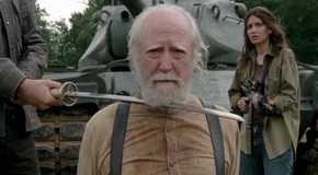 Hershel Greene (Scott Wilson) held captive with a sword to his neck in The Walking Dead.
