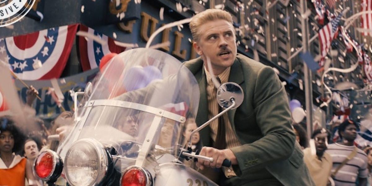 Boyd Holbrook as Klaber riding a motorcycle in a parade in Indiana Jones 5