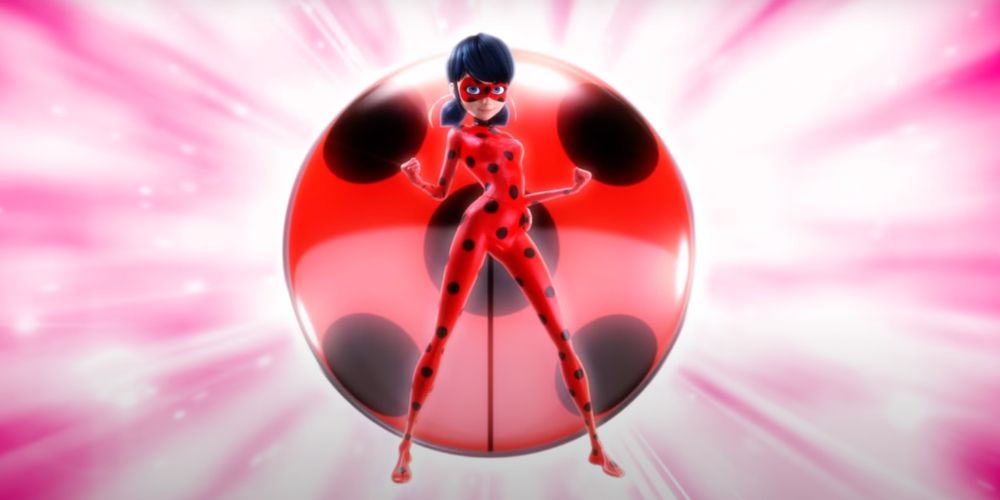 Ladybug from Miraculous Ladybug in front of her kwami symbol