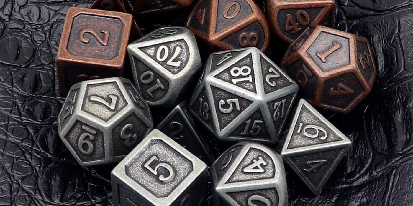 A set of iron and copper metal DnD dice