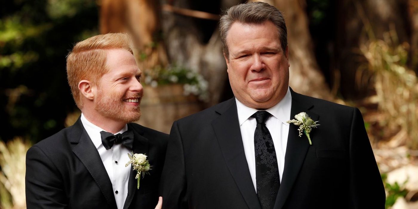Mitchell and Cam (played by Jesse Tyler Ferguson and Eric Stonestreet) at a wedding in Modern Family.
