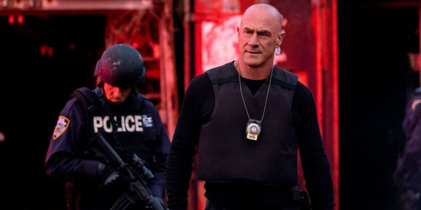 org crime s3 e7 stabler walks with a swat cop on a red background