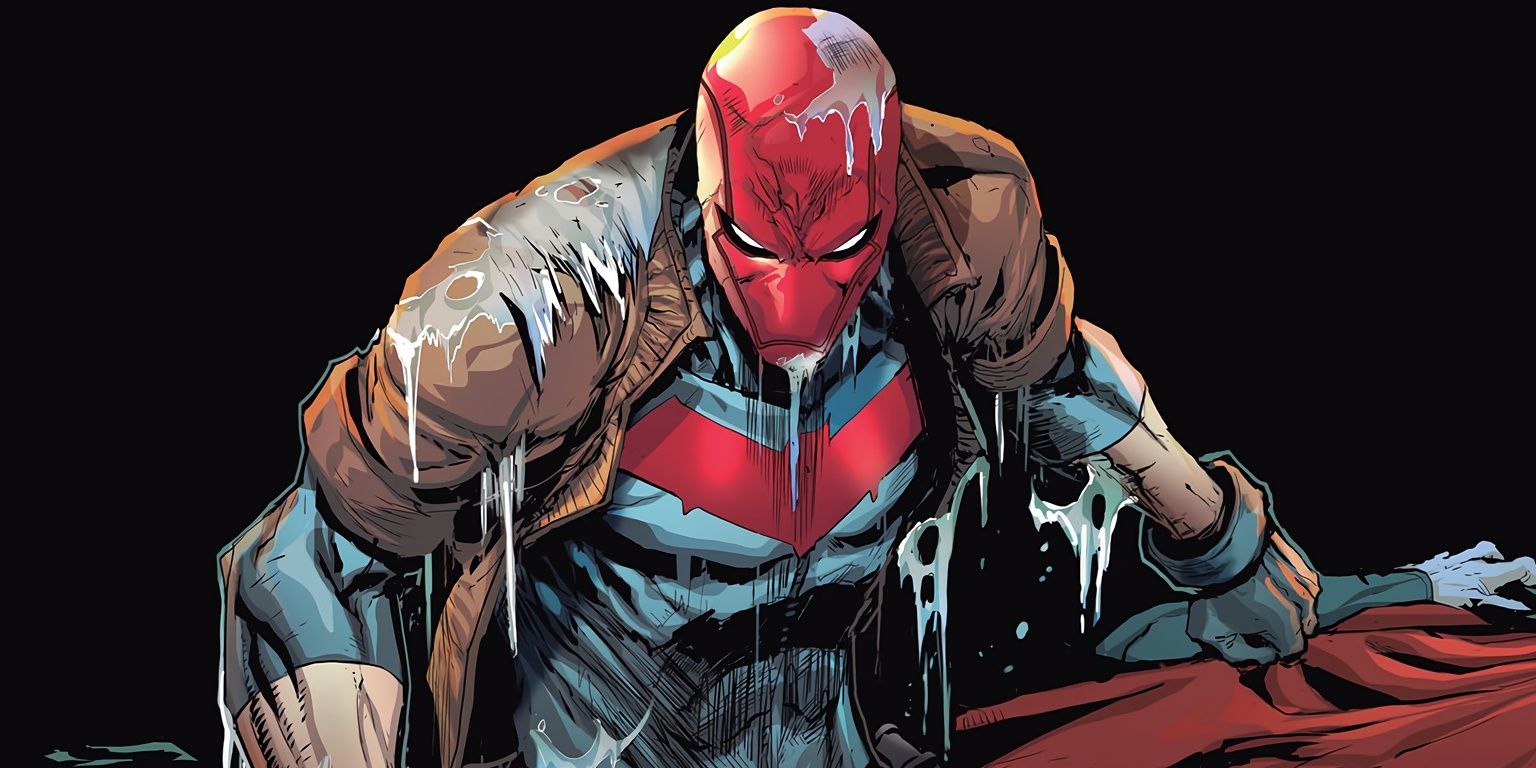 DC Comics' Red Hood glaring and emerging from water.