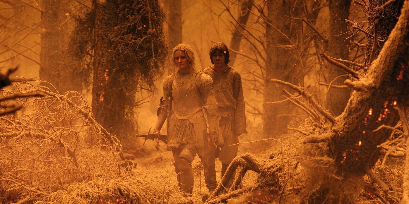 Galadriel walks through an orange-hazed Mordor in The Rings of Power. 
