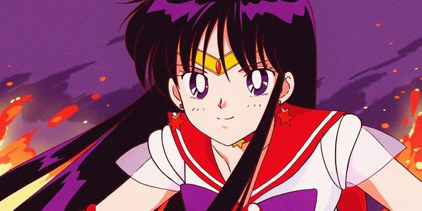 A closeup of Sailor Moon's Sailor Mars standing against a fiery backdrop.