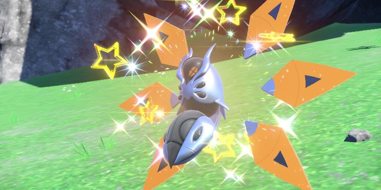 A Shiny Iron Moth Pokémon screeches as Shiny sparkles emanate from it.