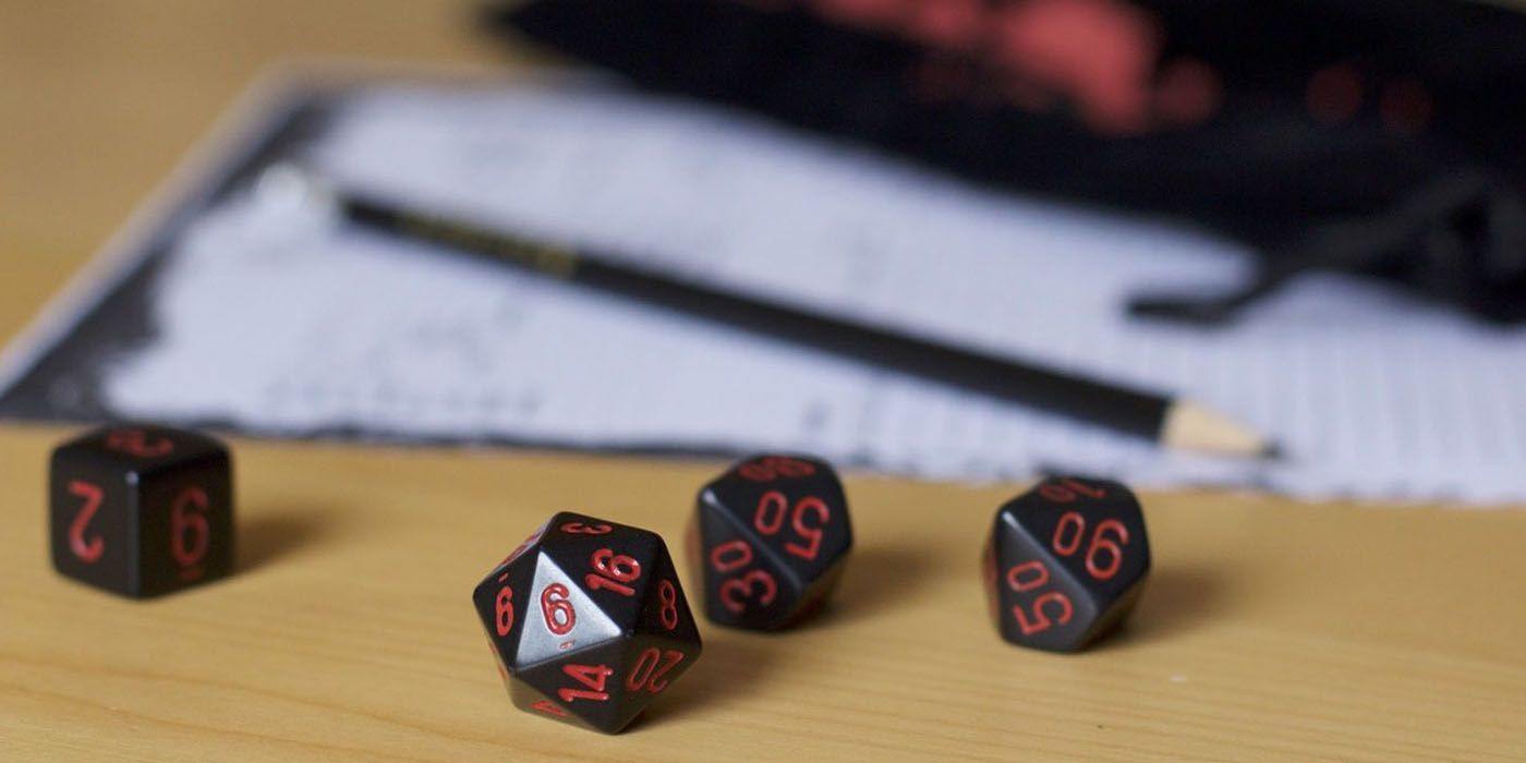 tabletop roleplaying game dice and pencil