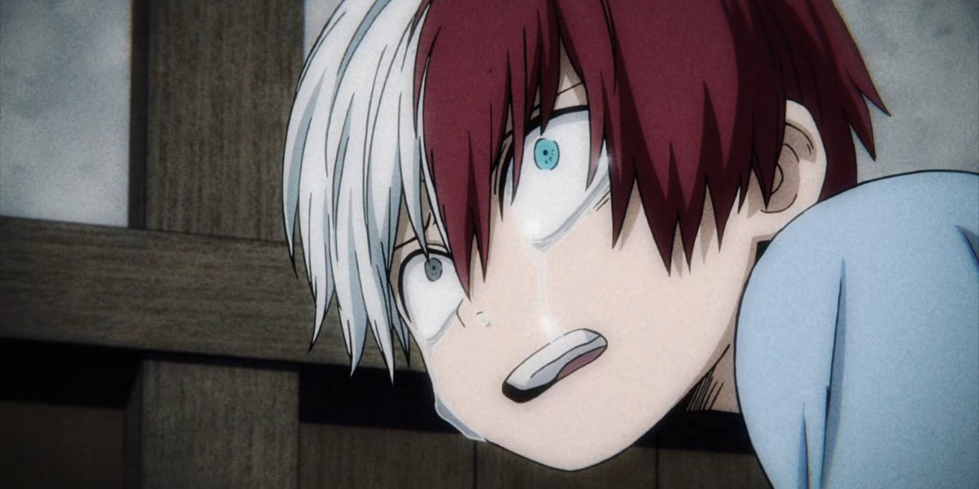 Young Todoroki from My Hero Academia looking up at someone crying and scared.