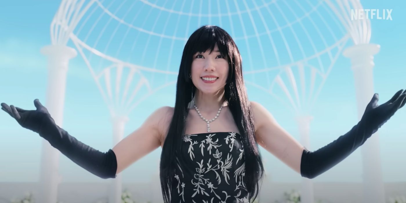 Alice in Borderland's Mira (Riisa Naka) raises her arms in front of a gazebo