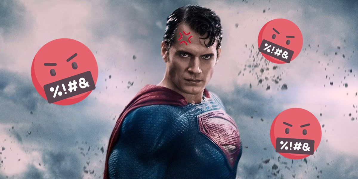 Superman with an anger mark on forehead and cussing emojis floating around