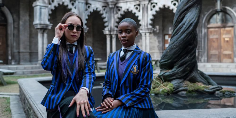 Bianca and Yoko in Wednesday sitting in the courtyard