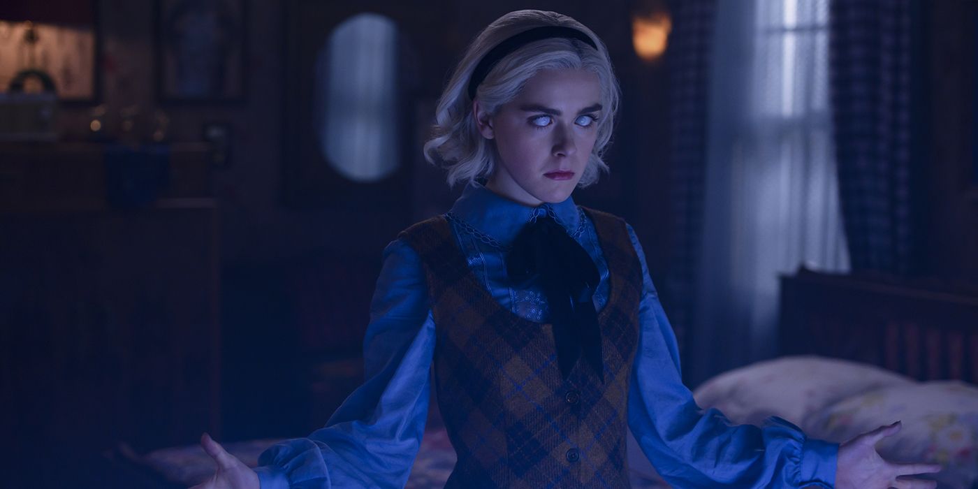 Sabrina from Chilling Adventures of Sabrina in a trance, arms up to her sides