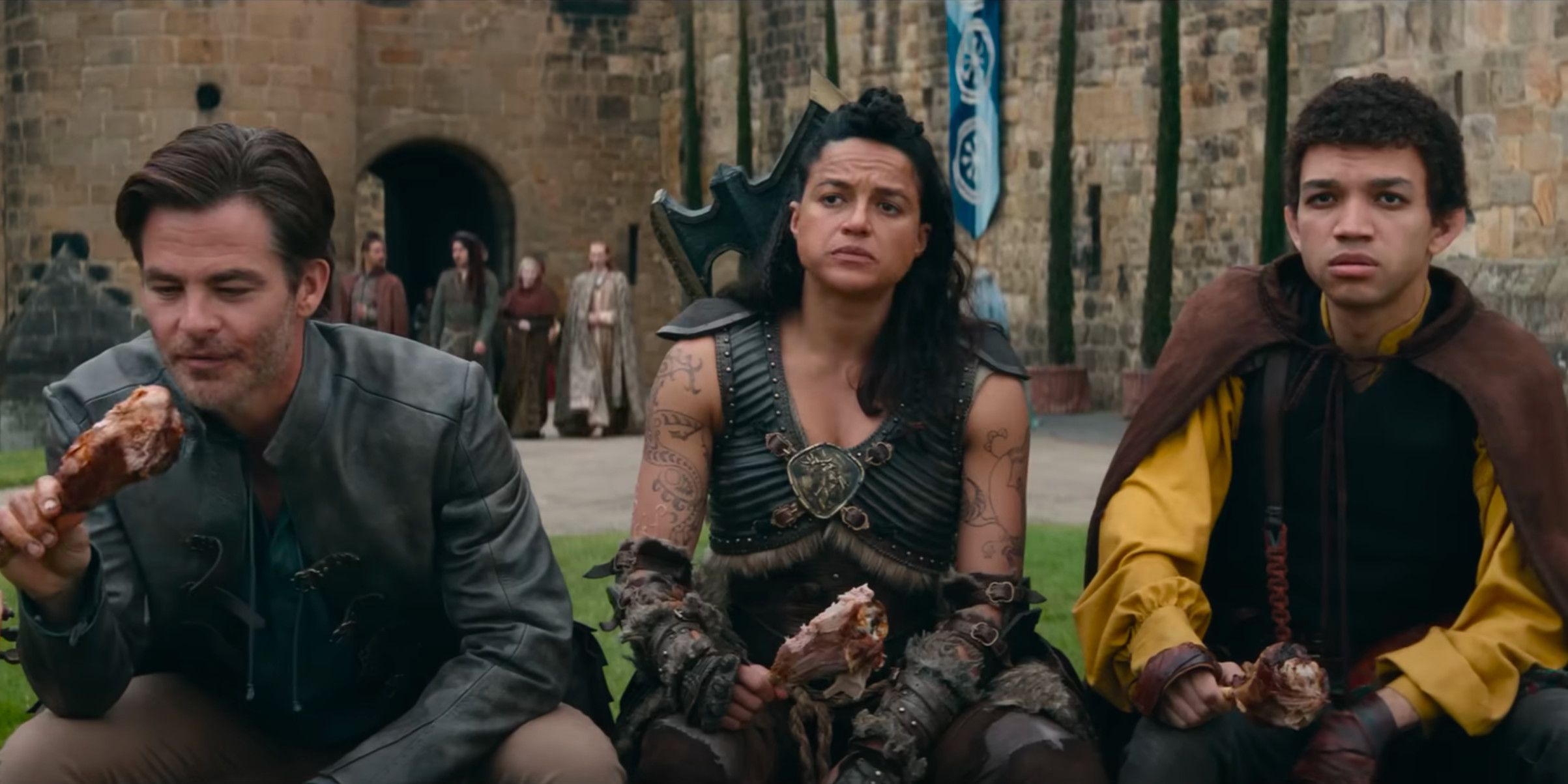 Chris Pine, Michelle Rodriguez and Justice Smith eating in Dungeons and Dragons: Honor Among Thieves.