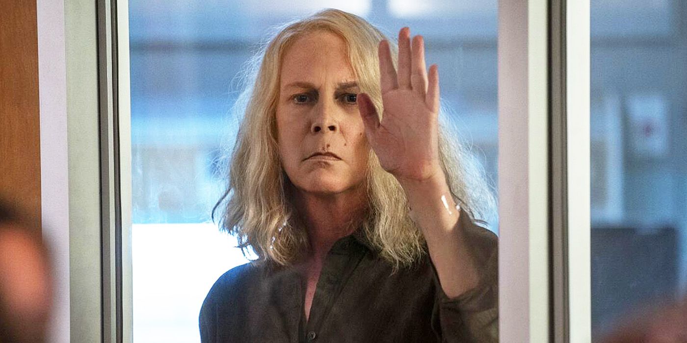 Halloween Ends: Jamie Lee Curtis' Laurie Strode presses her hand against a window.