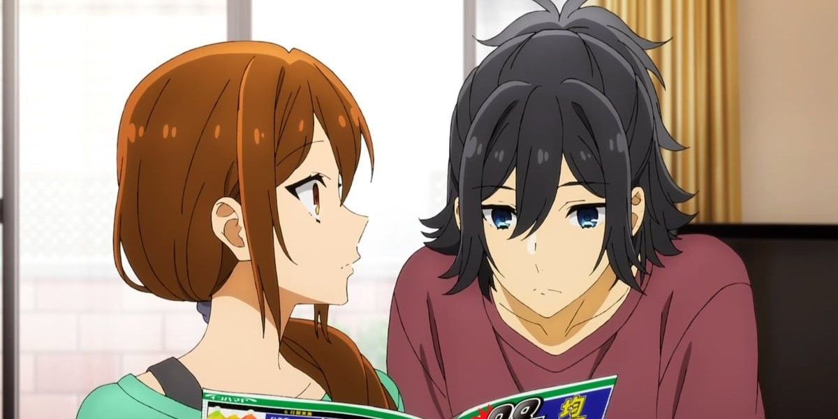 Hori and Miyamura looking through a book in the Horimiya anime