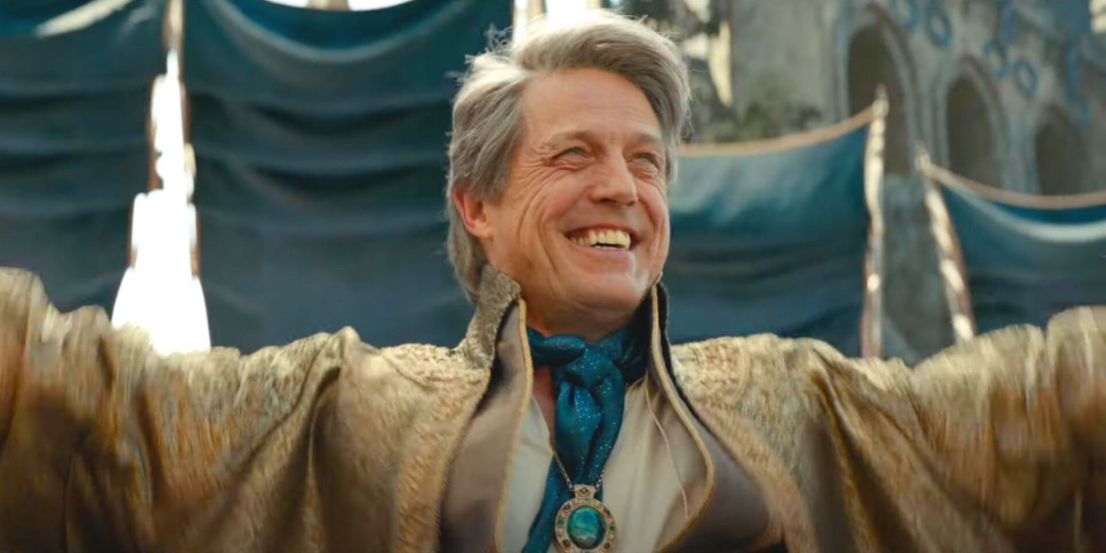 Hugh Grant grinning in Dungeons & Dragons: Honor Among Thieves.