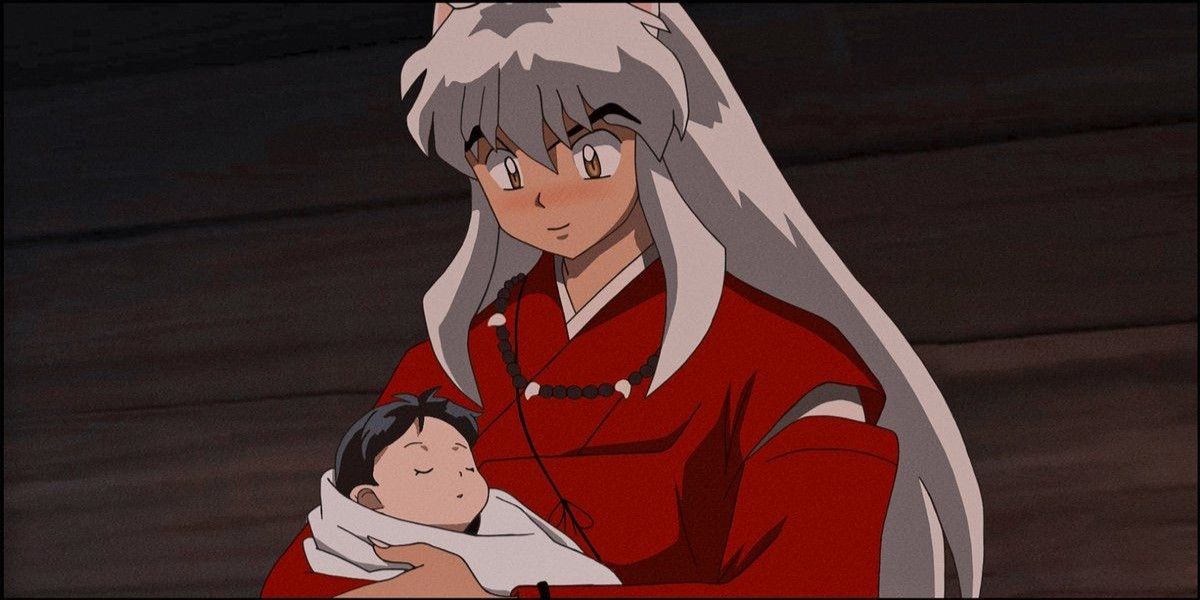 Inuyasha holds baby Moroha.