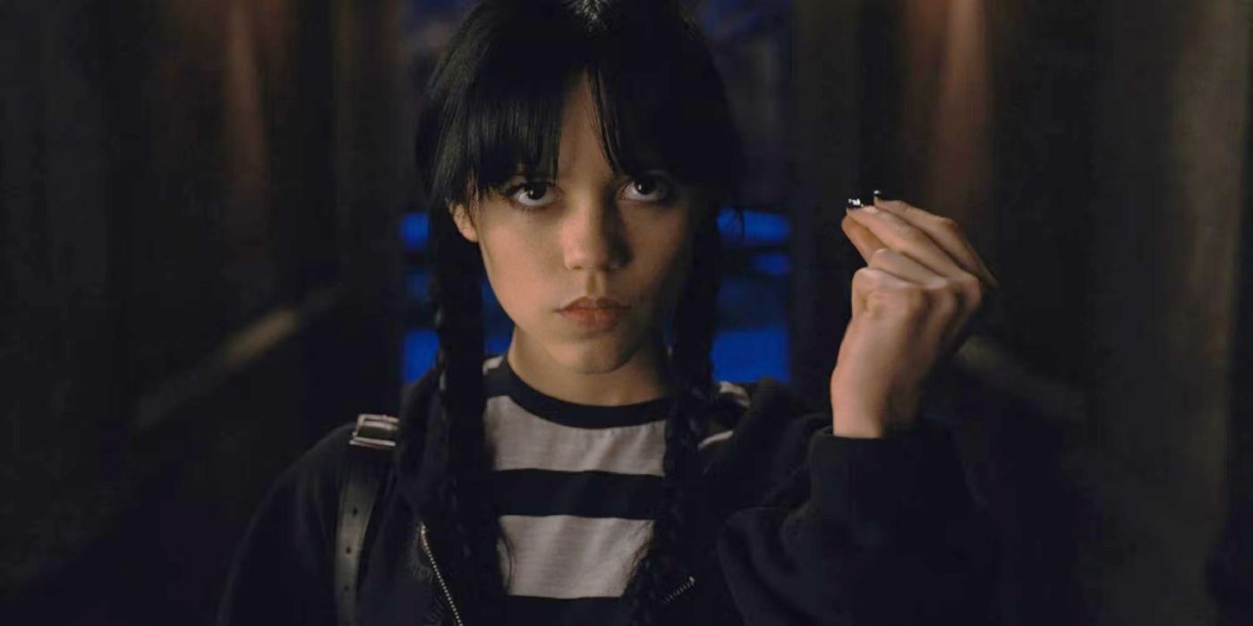 Wednesday Addams snaps her fingers during a scene in Wednesday.