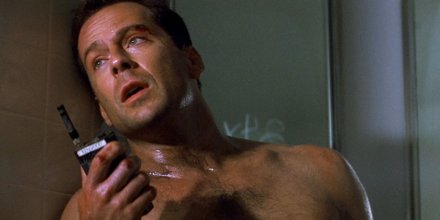 John McClane holding a walkie in Die Hard (1988).