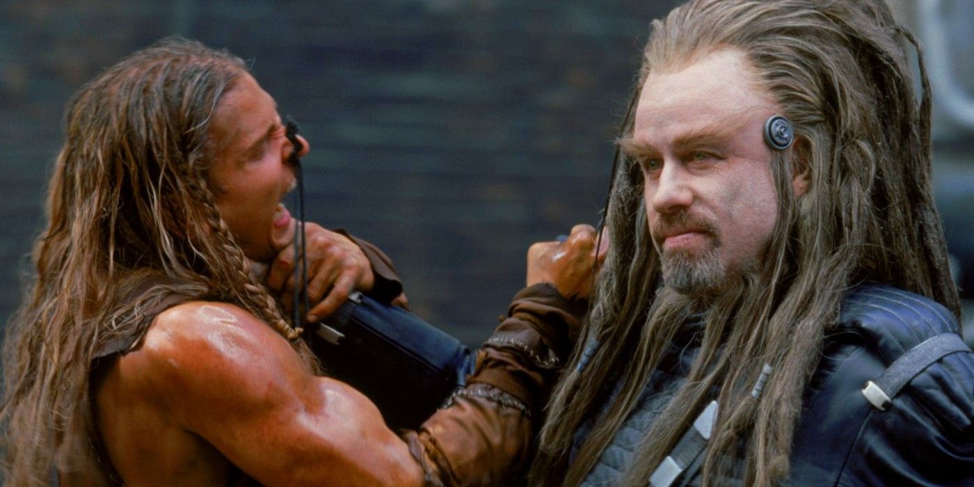 John Travolta as Terl choking a human rebel played by Barry Pepper