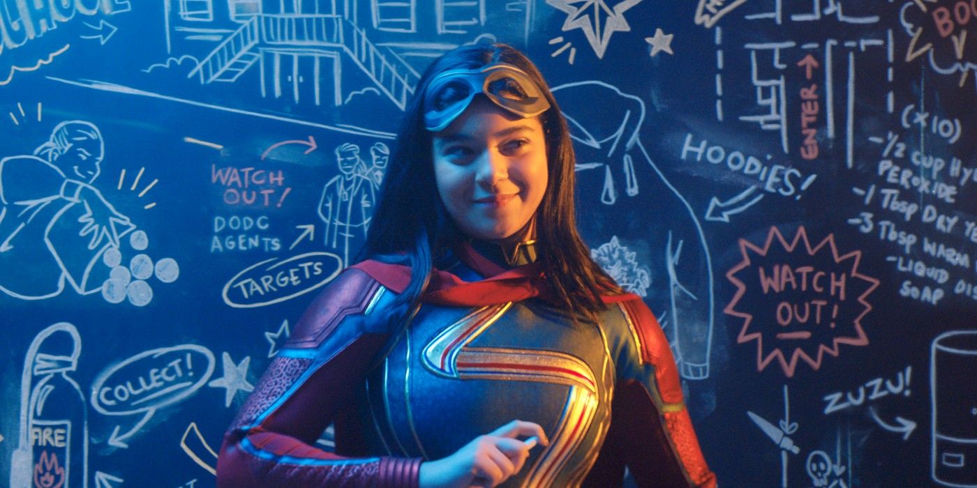 Kamala Khan standing in front of a blackboard and smiling in Ms. Marvel.