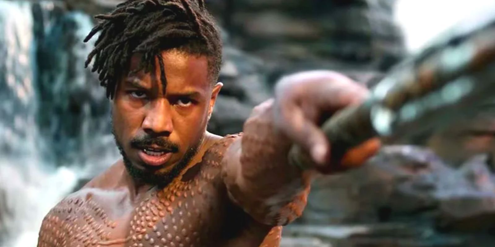 Killmonger extending a sword ready to fight in Black Panther