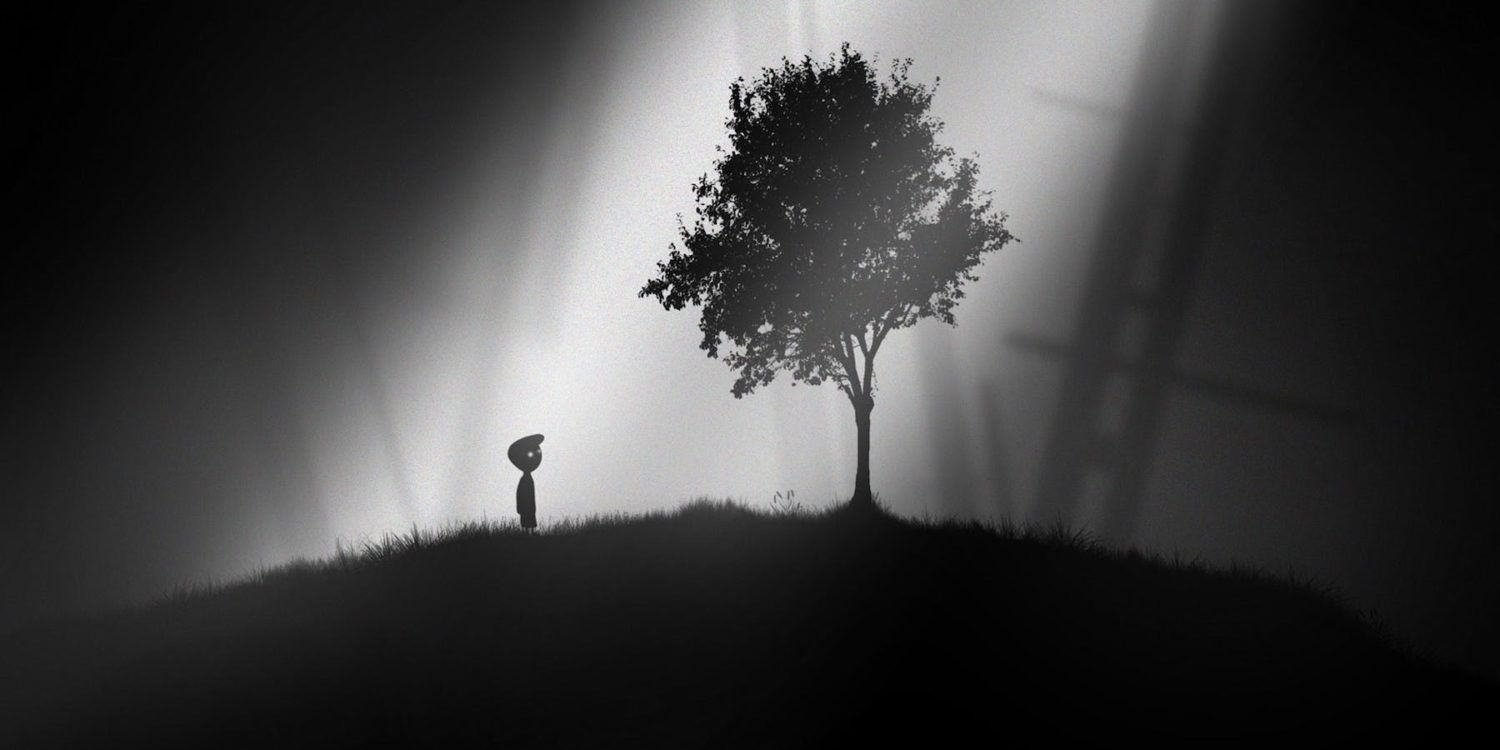 The little boy from Limbo stands under a tree