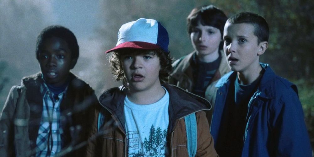 Lucas, Will, Dustin, and Eleven in Stranger Things Season 1.