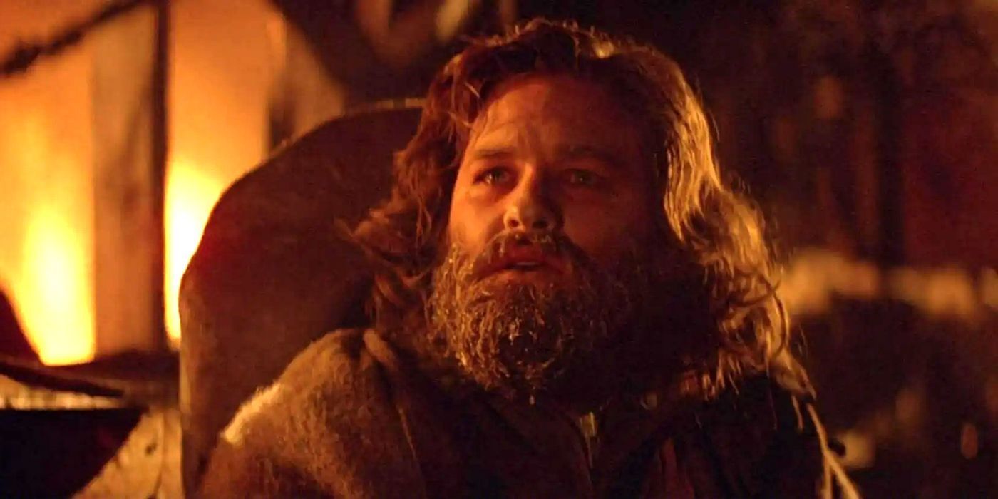MacReady by the destroyed base in John Carpenter's The Thing ending