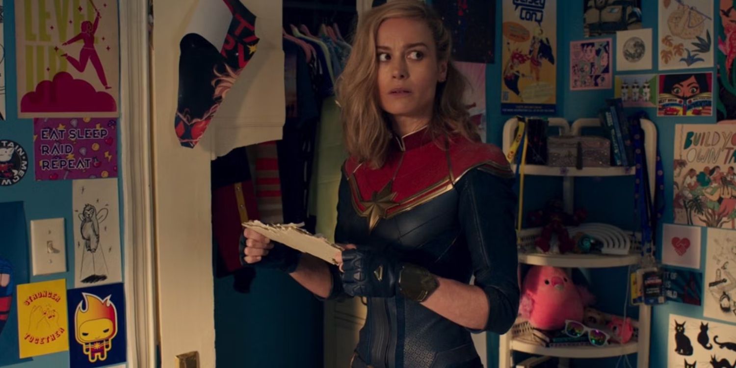 Ms Marvel holding a piece of paper looking surprised