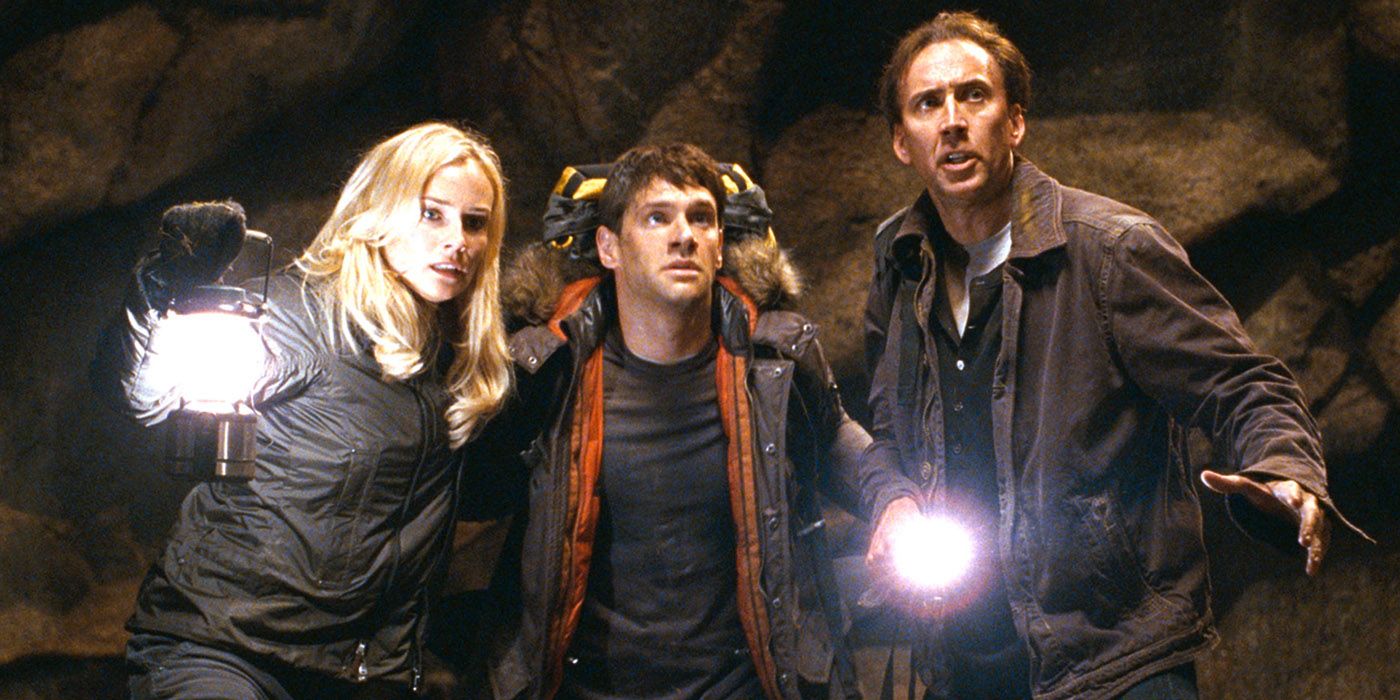 National Treasure: Book of Secrets: Diane Kruger, Justin Bartha and Nicolas Cage stand together in a cave..