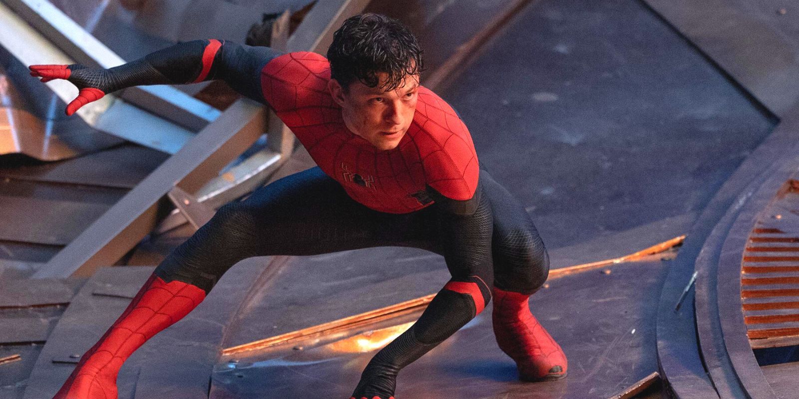 Tom Holland's Spider-Man poised for action on a destroyed metal structure