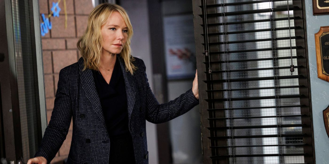 Law & Order: SVU's Amanda Rollins, played by Kelli Giddish, stands in an office doorway