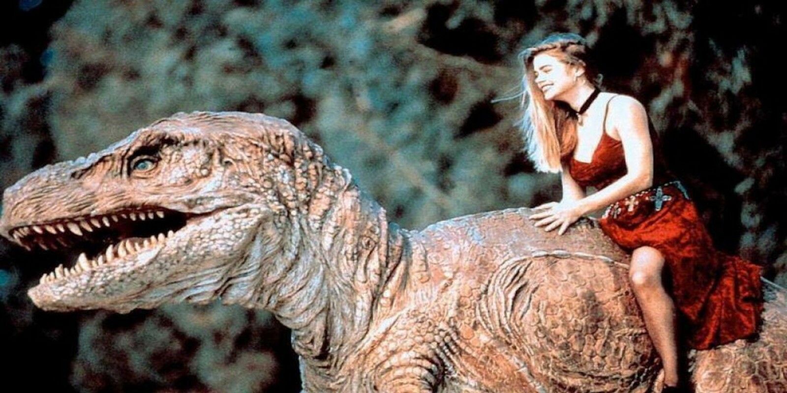 Tammy rides an animatronic dinosaur in Tammy and the T-Rex