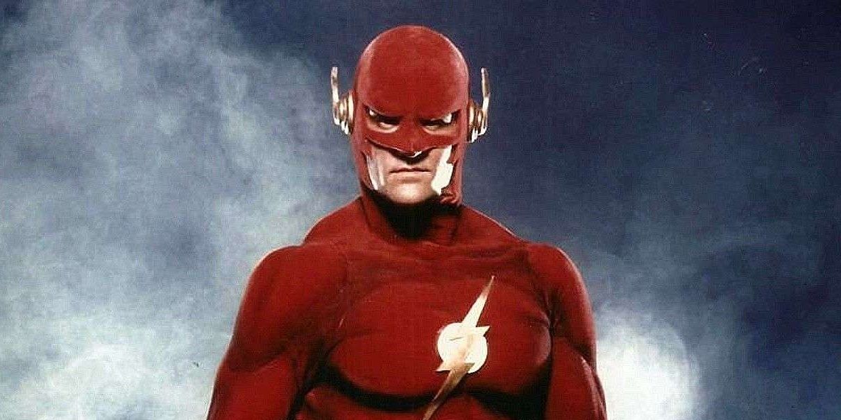 John Wesley Shipp as Barry Allen stands in front of smoke in The Flash 1990 TV series