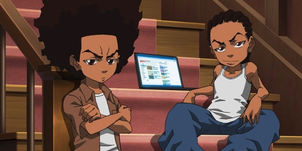 Two boys sit on stairs in The Boondocks.