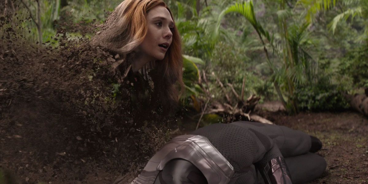 Wanda Maximoff turns to dust next to Vision's gray corpse in Avengers: Infinity War