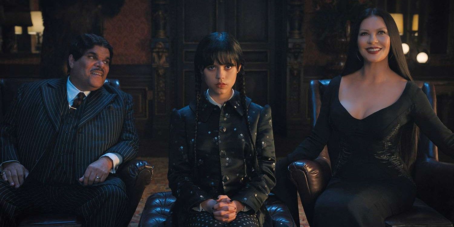 Wednesday Addams sits with Gomez and Morticia in Netflix's Wednesday