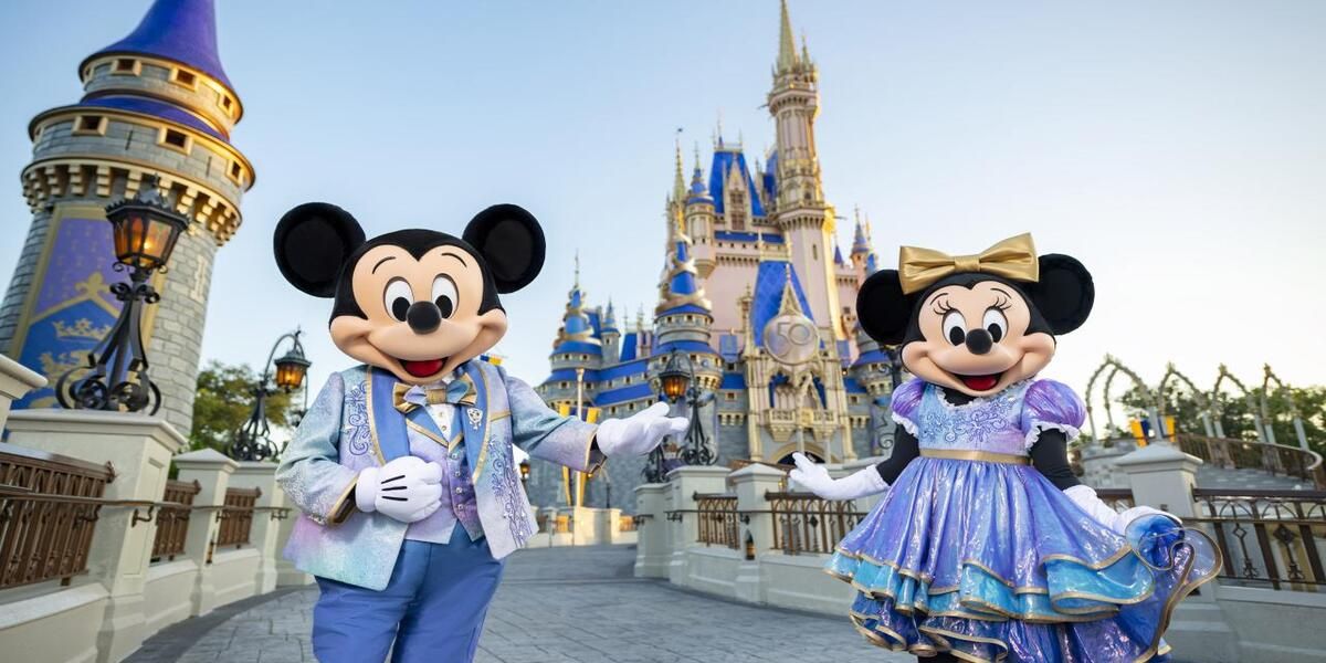 Mickie and Minnie Mouse stand in front of Walt Disney World in Florida