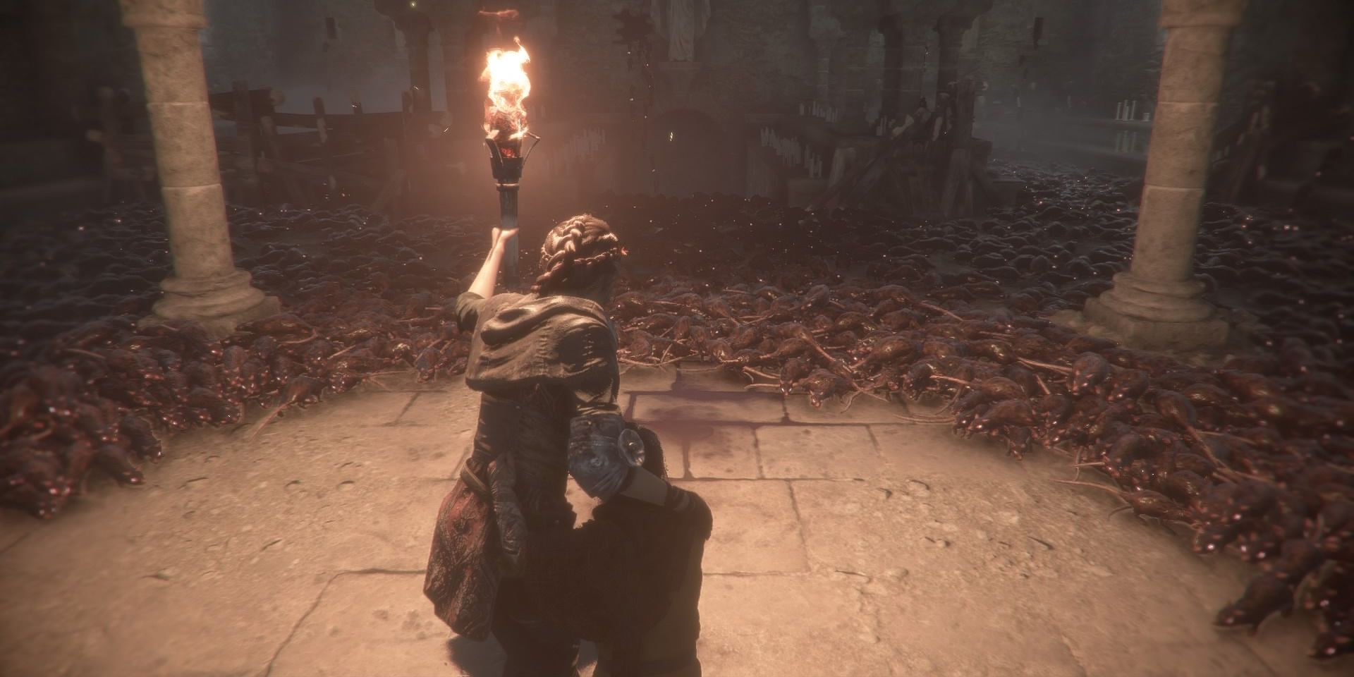 Amica de Lune protects her brother Hugo from an army of rats in A Plague's Tale Innocence