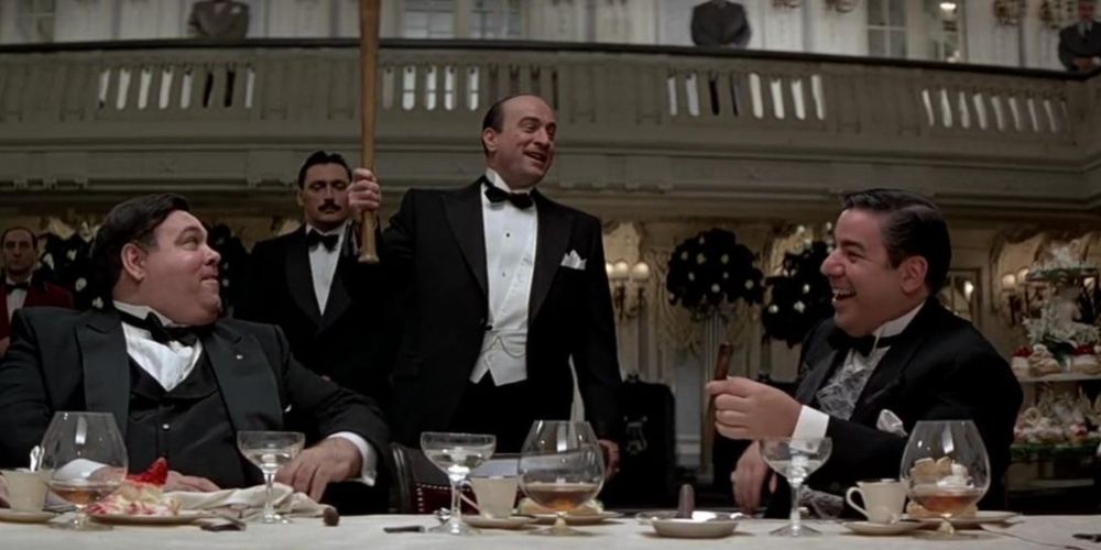 Al Capone jokes with his capos in The Untouchables